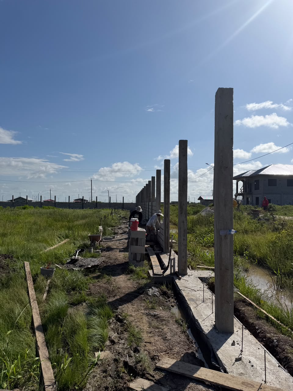 Concrete columns rising on filled foundation