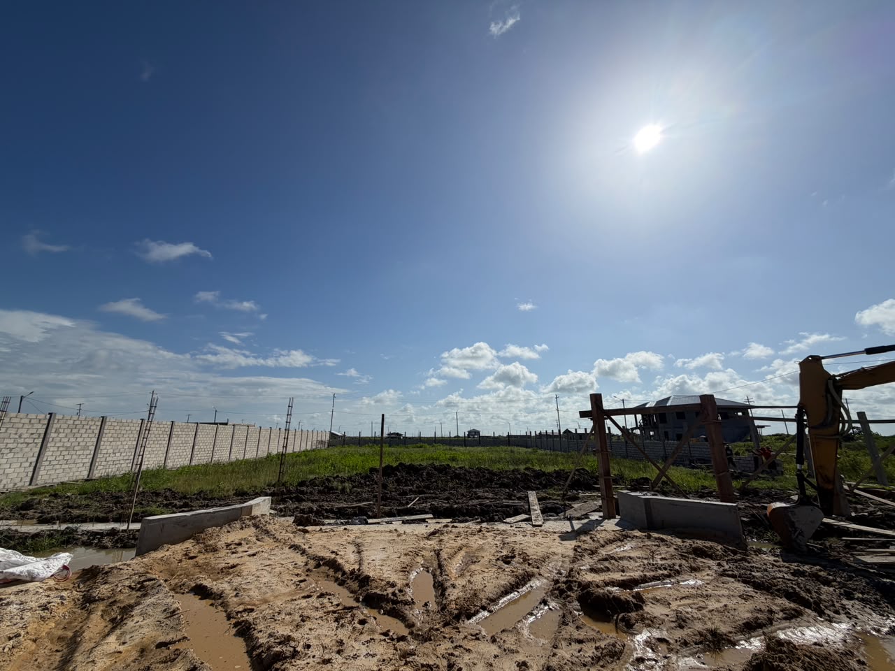 Land filling and compaction with excavator