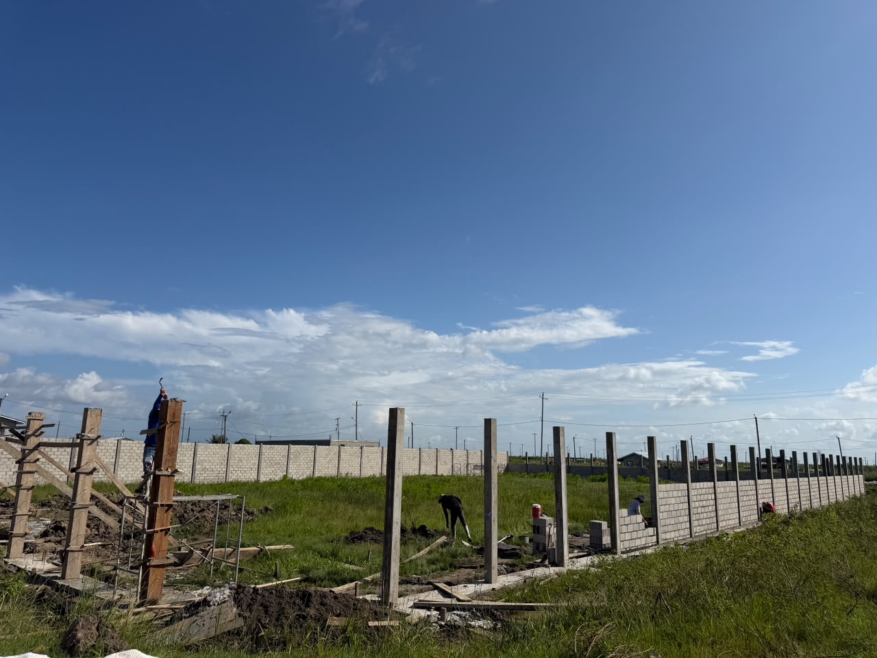 Block boundary wall and column line under construction
